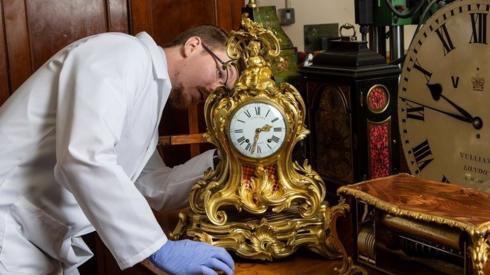 Fjodor working on a gold clock in his workshop