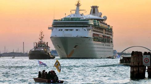 Protesters take action at the passage of a cruise ship in the Giudecca canal on September 30, 2018 in Venice, Italy