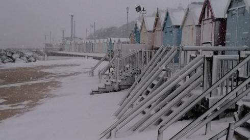 Snowy beach huts