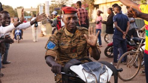 A soldier drives on a motorcycle as people gather to celebrate and support the Burkina Faso military in Ouagadougou - 24 January 2022
