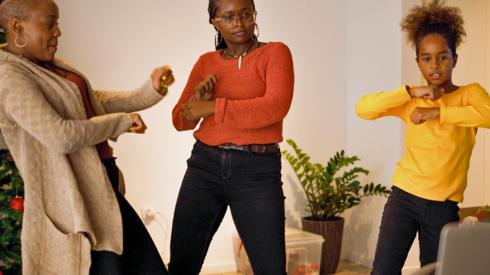 Three people doing a TikTok dance