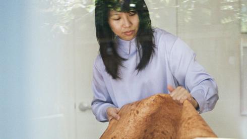 Sophia Wang holding a strip of Reishi