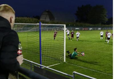 Fans watch a non-league match