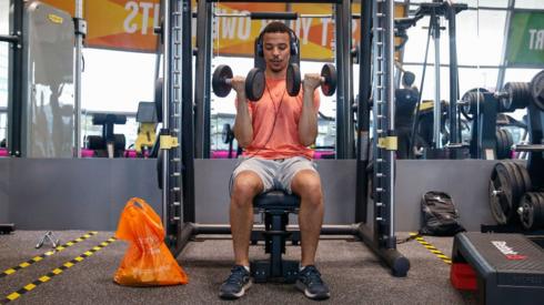 Man lifting weights in a gym