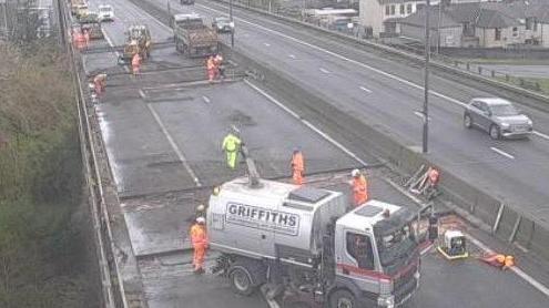 Road works vehicles and staff on M4