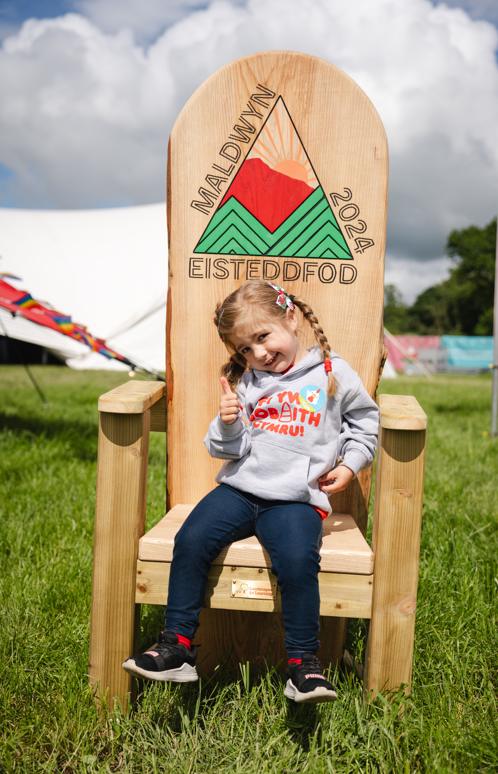 Little girl on an Urdd Eisteddfod chair