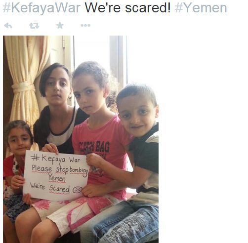 Children huddled on a couch