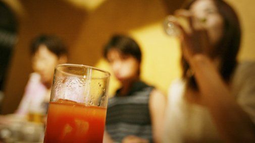 Young adults drinking juice
