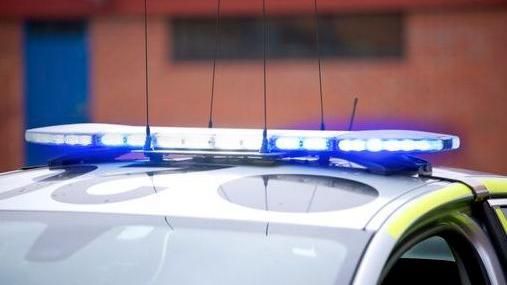 The top of a police car with its blue lights