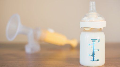 Breast pump and bottle of milk