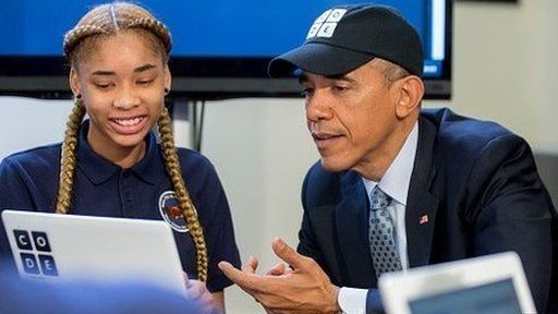 President Obama writing code with school child
