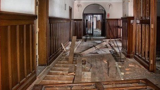 Ripped floorboards inside Ipswich's County Hall
