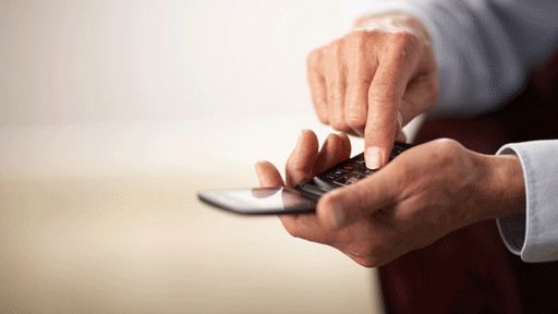 Older man using a phone, copyright Thinkstock