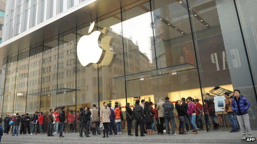 Customers outside an Apple store in China