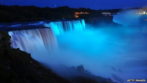 Visitors to Niagara Falls receive notice of the sex of the royal baby indicated by the blue light illuminating the falls in Niagara Falls, New York