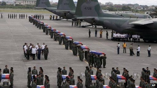 Philippine National Air Force transport coffins of 44 police commandos killed on Sunday