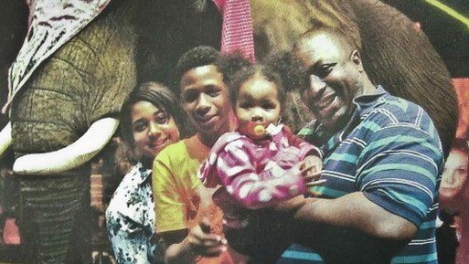 Eric Garner poses with his family on a day out in an undated photo