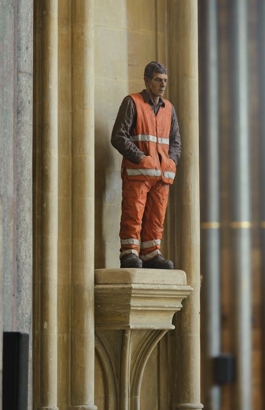 Figure in a hi-vis orange outfit