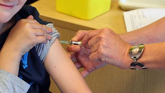 A child receiving the MMR vaccine.