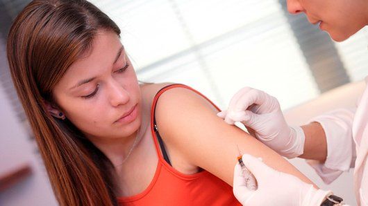 girl getting the vaccine