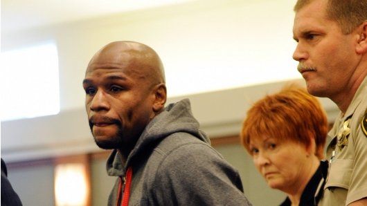 Floyd Mayweather Jr is lead away in handcuffs at the Clark County Regional Justice Center as he surrenders to serve a three-month jail sentence at the Clark County Detention Center on June 1
