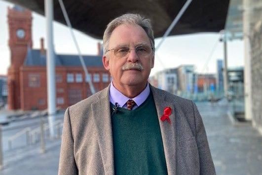 Mark Isherwood standing outside the Senedd in Cardiff Bay