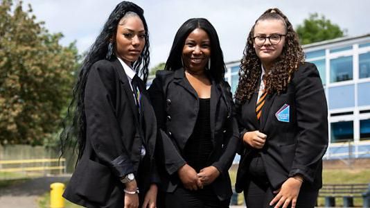 Two pupils with a behaviour expert