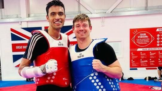 Mansouri poses with Aaron Cook, three-time European champion, at GB Taekwondo's Manchester base