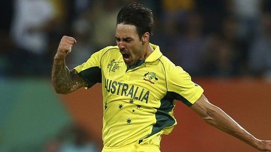 Mitchell Johnson of Australia celebrates after taking the wicket of Rohit Sharma