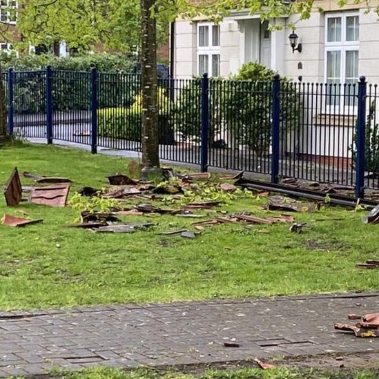 Tiles could be seen strewn across gardens outside people's homes