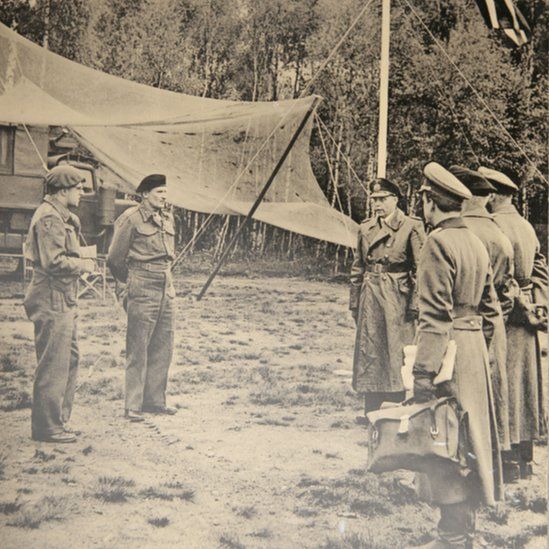 German delegates approach Field Marshal Montgomery (second left) for the first time