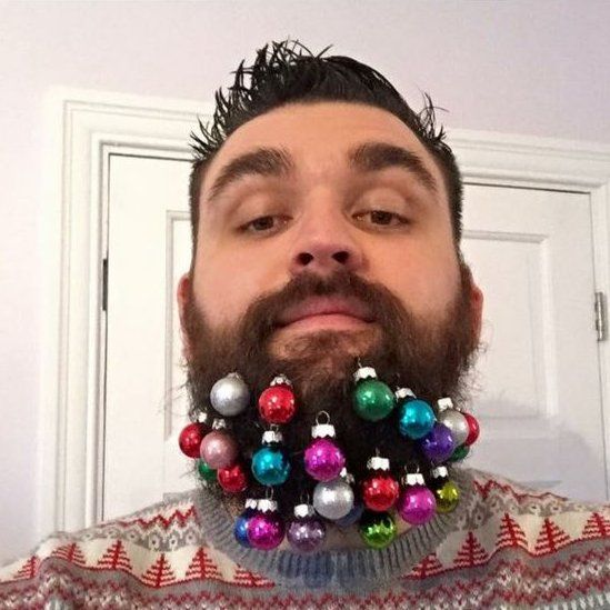Man with baubles on his beard