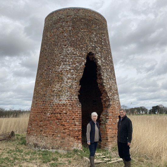 Man a woman outside an old kiln on Catfield Fen