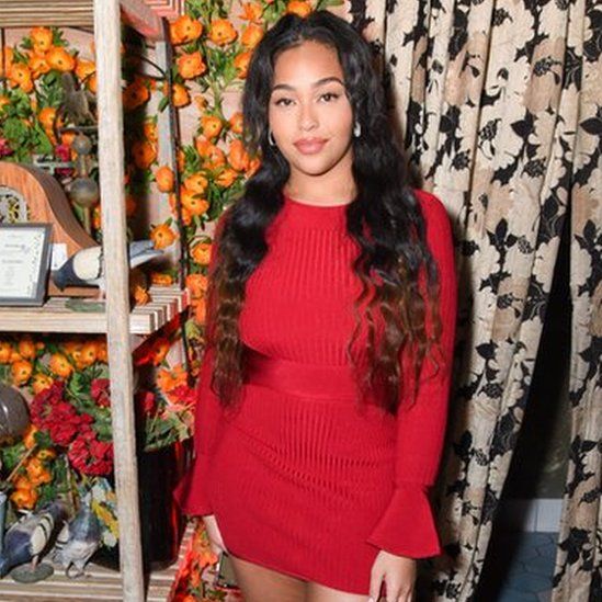 Jordyn Woods wears a dress at an Oh Polly launch