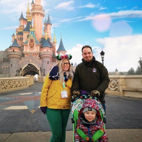 Melissa Hamblett, husband James and son Max outside the magical castle at Disneyland