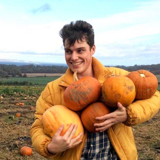 Scott Ridout with the pumpkins he gathered