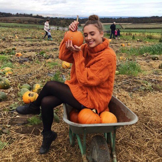 Sarah Alexandra posing with her pumpkin