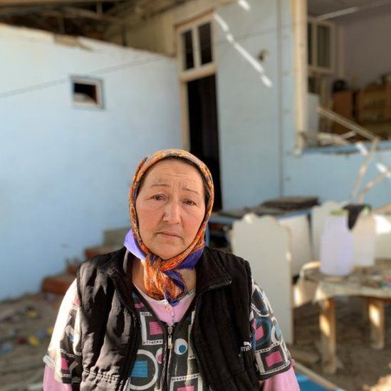 Nushabe in the debris of her home in Ganja