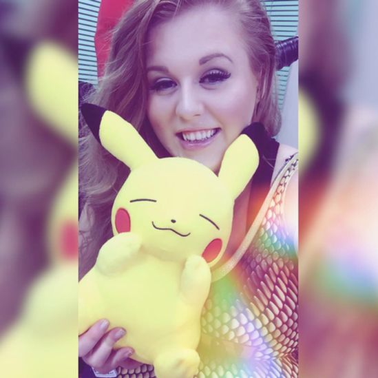 woman with pikachu toy