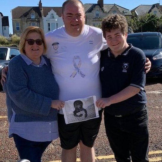 Peter Byrom pictured with wife Denise and son Harrison