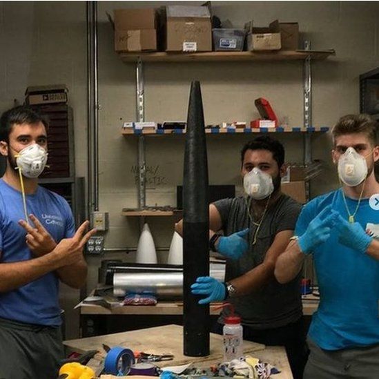 Students working on building the rocket