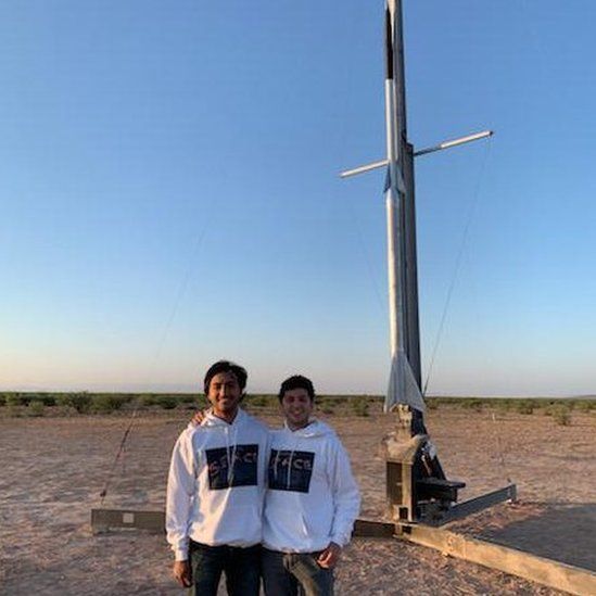 Students Joshua Farhazad and Saad Mirza with the rocket they've helped to design and build