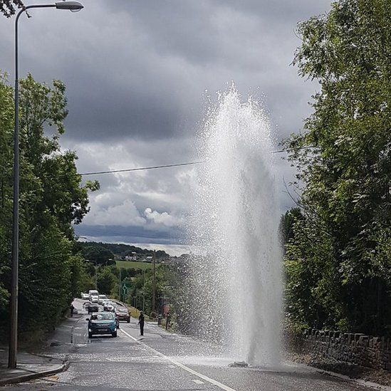 Burst water main sends water high into the air