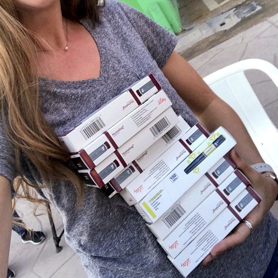 Emily Mackey holding insulin pens she bought in Mexico