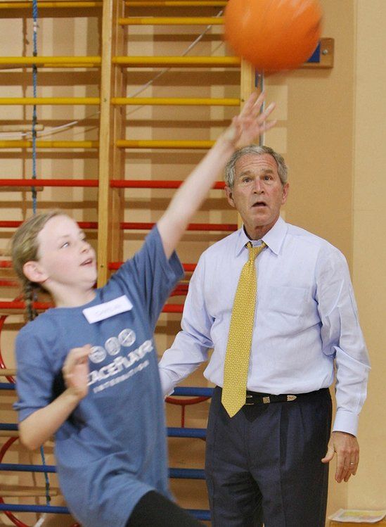 George Bush playing basketball during a visit to Northern Ireland