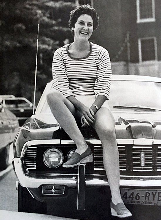 Maryann Gray pictured in 1975 or 1976, sitting on the hood of the 1968 Mercury Cougar that she was driving at the time of the accident