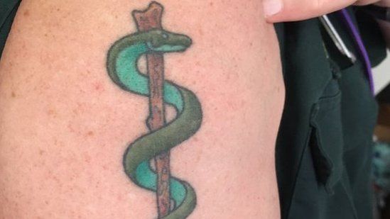 Graham's serpent tattoo