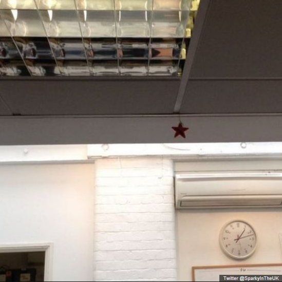One Christmas star hanging from the ceiling in the office