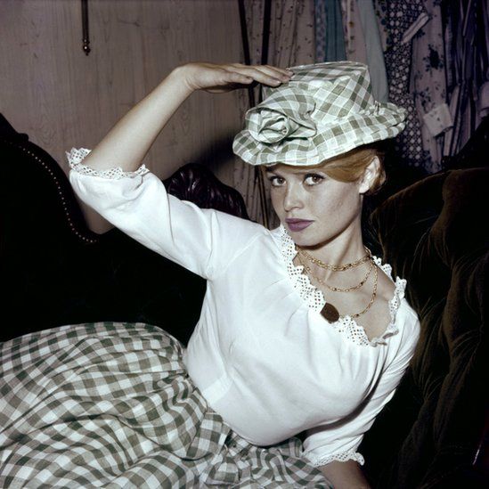Brigitte Bardot featured in one of Weiss's portraits, here trying on a Vichy skirt in 1959