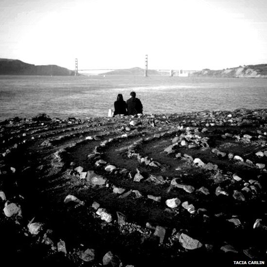 Couple sitting by a river